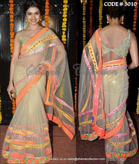 3010 Prachi Desai's beige and neon saree
