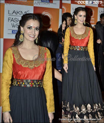 2075 Dia Mirza's black-orange-yellow pleated gown